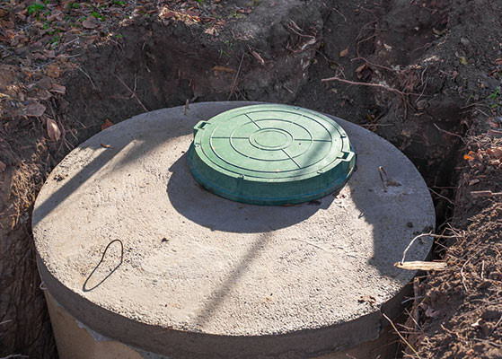 Septic tank made of concrete rings with a hatch — Precast Concrete Products in Coffs Coast, NSW