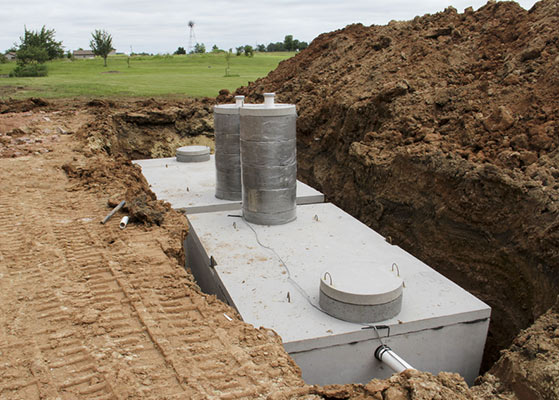 Concrete septic holding tanks in the ground — Precast Concrete Products Near Me in Kyogle, NSW