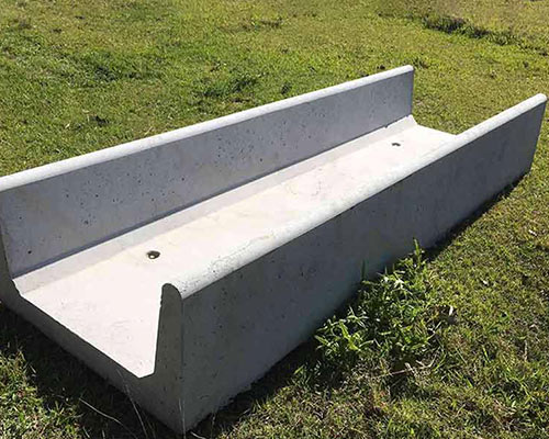 small concrete feed trough