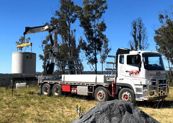White semi truck loading decant tower — Concrete Products in Kyogle, NSW